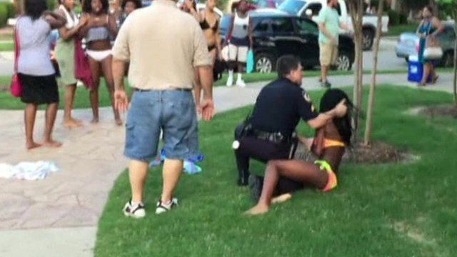 police officer pushes teenage girl to ground