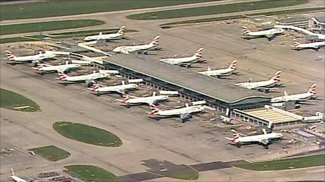 Airplanes waiting at a terminal