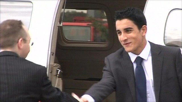Young businessman Joseph Hayat in front of a plane