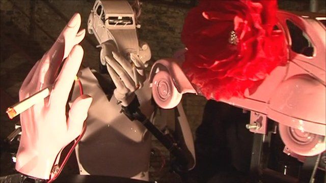 Robots with cars as heads that smoke cigarettes
