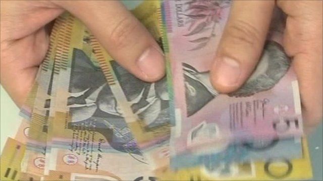 Australia dollar hits parity with US - BBC News