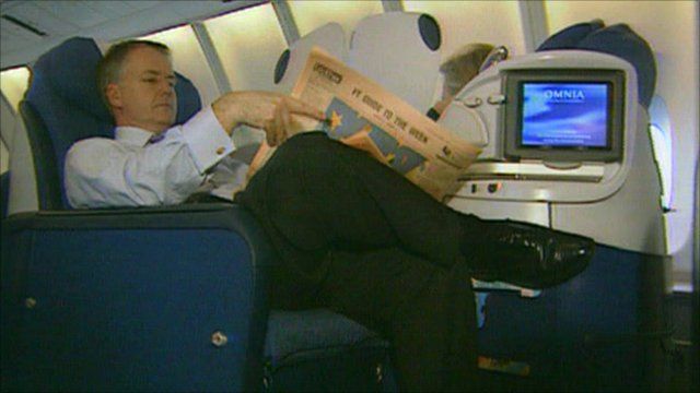 A passenger relaxes in business class