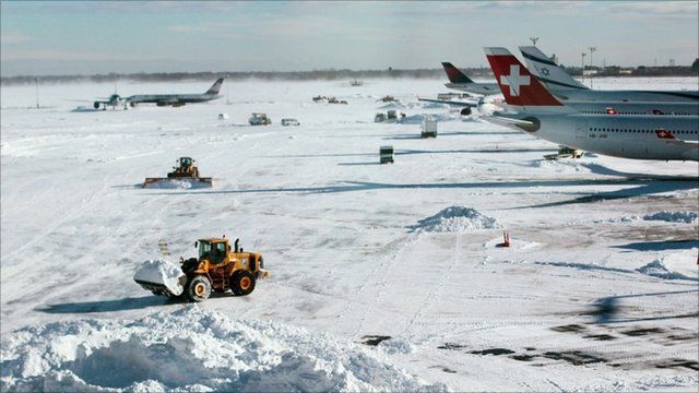 Airports reopen after US snow storm brings travel chaos - BBC News