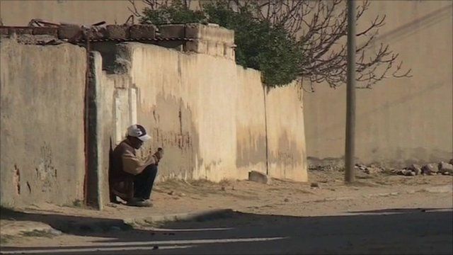 Man sits in Tunisian street
