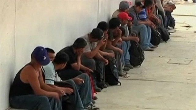 Migrants in holding area