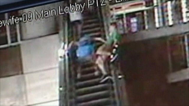 CCTV of teenager on an escalator