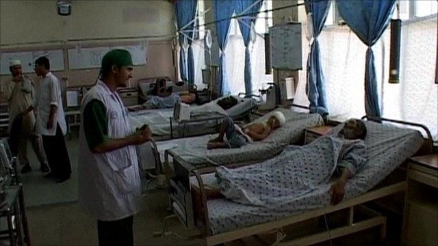 Doctor with survivors of a bus crash, in a hospital in Afghanistan