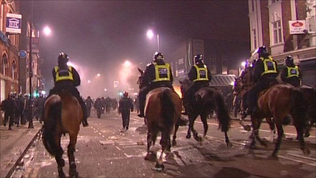 Mounted police heading towards rioters