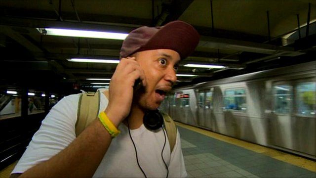 New York commuter using phone on the subway