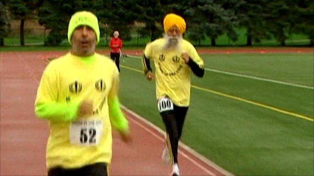 Fauja Singh (right) and his translator and coach Harmandar Singh (left)