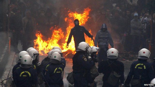 Protesters face riot police in Athens