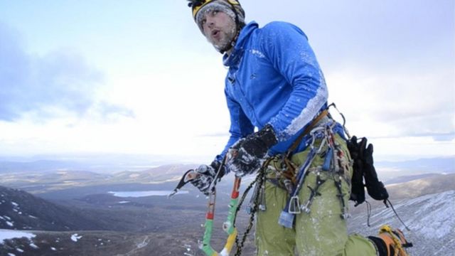 Climber Gregg Boswell on top a Scottish Hill