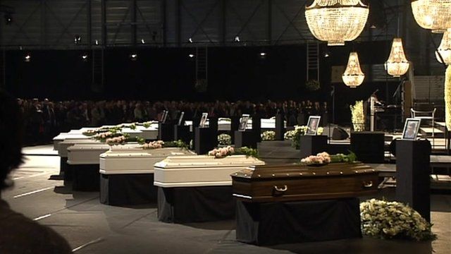 Mourners in the northern Belgium town of Lommel attend service for some victims of the bus crash in Switzerland