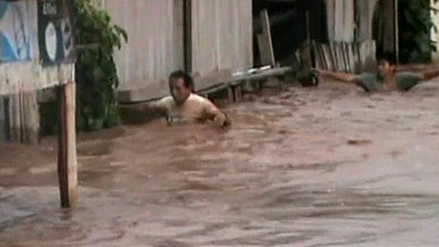 A man chest-deep in water