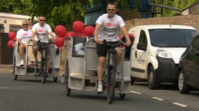 Fundraisers cycle rickshaws across Clifton Suspension Bridge for charity