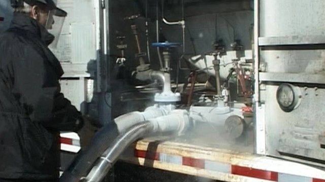 Worker at liquefied gas pump