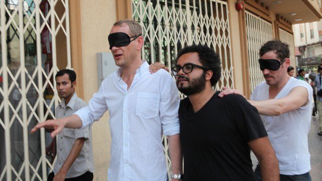 A blindfolded Christian Jankowski is shown around Dubai by Rami Farook