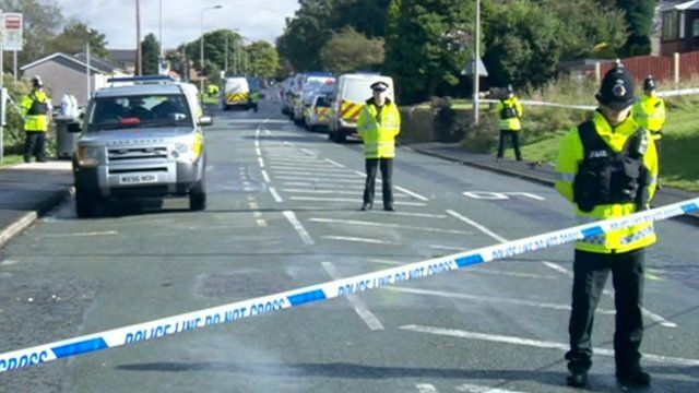 Police officers at the scene of the shooting