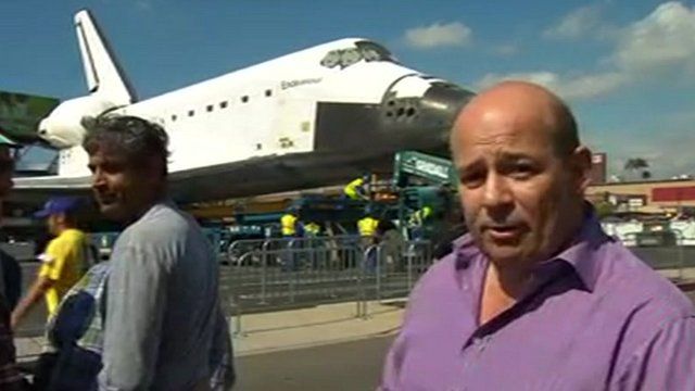 Alistair Leithead in front of the retired space shuttle Endeavour