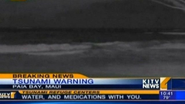 Tsunami waves reach land