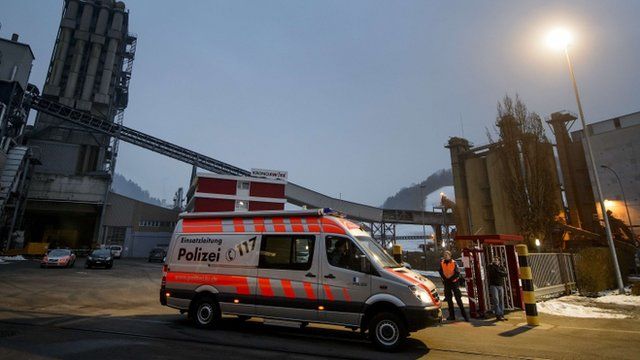 Police van outside wood plant, Switzerland