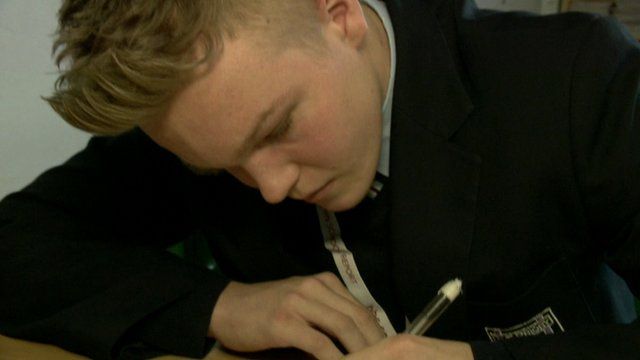 A school pupil writing