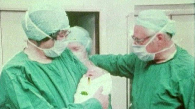 Sir Robert Edwards holding IVF baby Louise Brown