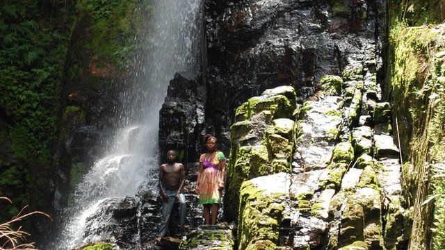 Villagers by the waterfall