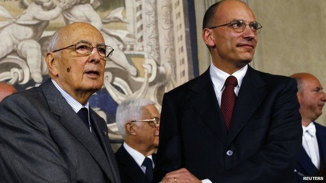 Italian Prime Minister-designate and deputy leader of the centre-left Democratic Party (PD) Enrico Letta (R) shakes hands with President Giorgio Napolitano