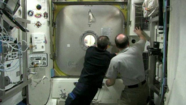 Astronauts preparing for spacewalk