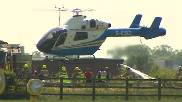 Helicopter lifting off at Cranfield Airport