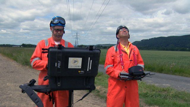 Men operating a drone