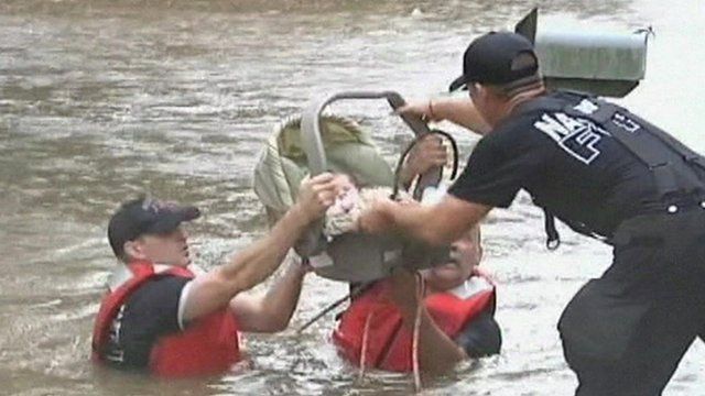 Baby rescued from flood waters