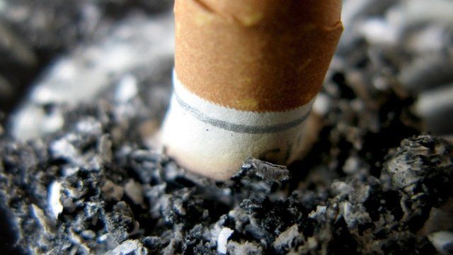 Stubbing out a cigarette