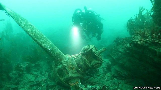 Diver with wreckage of Sunderland plane