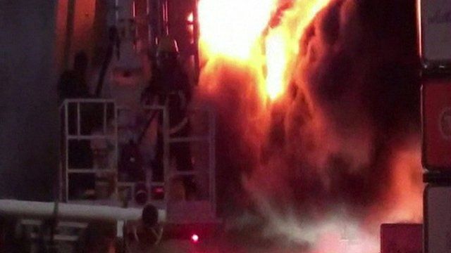 Firefighters at Raajje TV station in the Maldives, 7 October