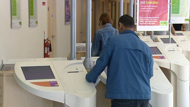 People looking at job adverts