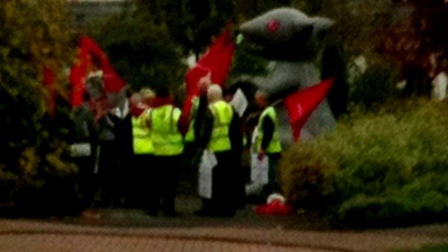 Demonstrators from Unite gather outside the driveway of the home of a Grangemouth company boss in Fife, with a giant inflatable rat