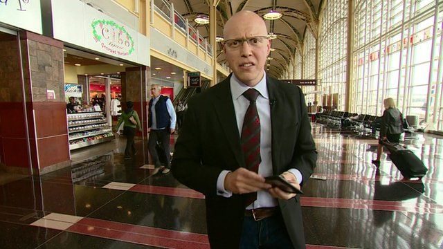The BBC's Jonny Dymond uses an e-reader at Washington National Airport