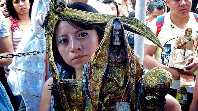 Devotee prays to Santa Muerte
