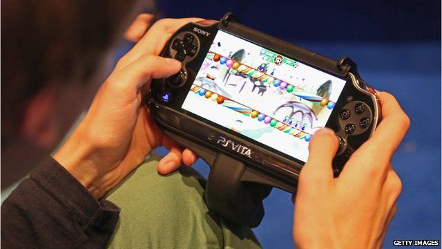 Man playing a PS Vita