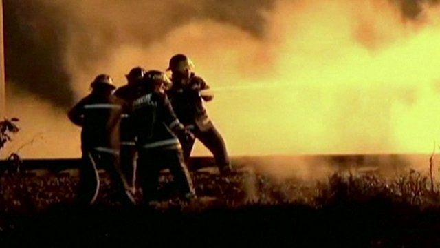 Fire-fighters in the Mexican city of Acolman try to extinguish the fire caused by the explosion of a pipeline