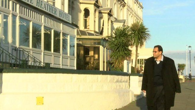 Egyptian businessman walking in Wales
