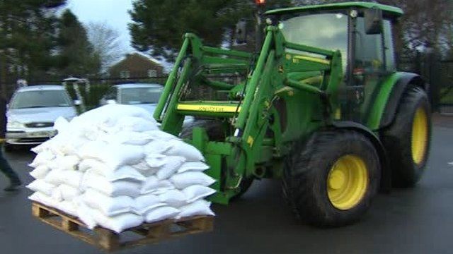 Tractor carrying sandbags