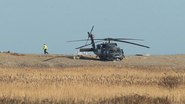 A helicopter near the scene of the crash