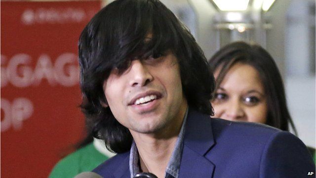 Shezanne Cassim speaks to reporters at Minnesota airport