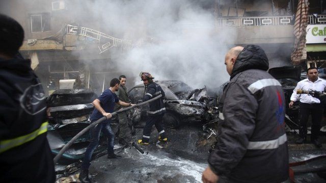 Firefighters put out a fire at the site of the explosion