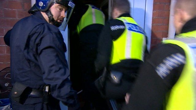 Police going into house