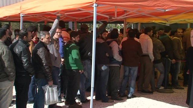 Refugees queue in Beirut