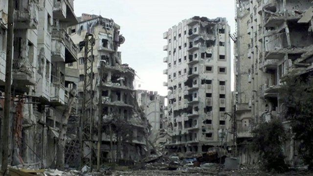 Badly damaged buildings in Homs